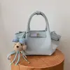 Bolsa balde tendência de nicho para carregar na mão, nova moda primavera 2026 bolsa de ombro estilo coreano, bolsa transversal de alto valor para mulheres