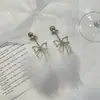 Brincos de pena de diamante com laço de temperamento doce de luxo leve, brincos de pelúcia de personalidade exagerada da moda, estilo fada