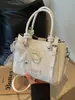 Bolso pequeño súper popular para el trabajo, nuevo de verano 2026 para mujer, patrón tejido de nicho, bolso cruzado de hombro único tipo cubo