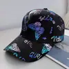 Gorra de béisbol de transferencia de calor con letra de grafiti y mariposa, nueva para el verano, para mujer, versátil, que adelgaza la cara, protectora del sol, sombrero tipo visera para el sol