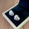Elegante conjunto de collar y pendientes de corazón totalmente de diamantes, cadena para la clavícula de acero de titanio moderna y versátil, joyería de alta calidad de moda al por mayor