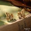 Estilo de corte europeo y americano oro ruso nicho nuevos aretes medievales borla perla diseño ojo de tigre aretes de alta gama