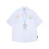 Camisa Listrada de Manga Curta com Estampa Graffiti Estilo Americano 2026 Nova Solta Estilo Coreano Estilo Preguiçoso Camisa Top