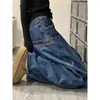 Jeans preto bordado estilo retrô americano para homens, calças de perna curva com design único, calças compridas de hip-hop com múltiplos bolsos