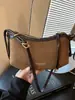 Bolso liso muy elegante 2026 nuevo bolso de axila francés de nicho para el día a día bolso de hombro cruzado casual a la moda para mujer
