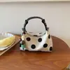 Bolso de mano de lunares transfronterizo, nuevo bolso de hombro y bandolera estilo coreano, bolso popular para mujer, bolso pequeño exquisito, bolso tipo dumpling, bolso de axila