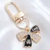 Llavero de Mariposa de Esmalte Blanco y Negro de Gama Alta, Colgante Completo de Diamante, Mariposa Combinada con Colgante de Oro, Llavero DIY, Colgante Pequeño