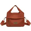 Bolsa de ombro feminina 2026 primavera e outono novo tecido de nylon bolsa de mão urbana simples casual bolsa de mãe bolsa transversal