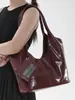 Bolso nuevo de principios de otoño 2026, bolso cubo liso vintage, bolso de mano simple, bolso de hombro a la axila moderno y relajado