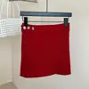Falda de punto de lana de algodón estilo coreano con botones y un diseño único, cálida y versátil para mujeres en otoño e invierno, adecuada para usar en capas