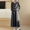 Conjunto de falda de tres piezas para uso casual en primavera y otoño, con un aire de alta gama estilo coreano, que incluye un cárdigan, una camisola y una falda.