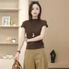 Falda de moda, camiseta de manga corta, top ajustado popular nuevo de principios de otoño para mujer, blusa moderna y elegante de este año