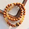 Pulsera con Diseño Multicírculo de Sándalo Natural, Cristal Amarillo y Ojo de Tigre