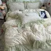 Estilo ins, fresco y simple, juego de ropa de cama de cuatro piezas de algodón puro, diseño de princesa estilo coreano, algodón lavado, estampado floral, ribete floral grande, juego de tres piezas apto para estudiantes
