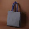 Bolsa de mano no tejida con hebilla tienda de ropa tienda de gafas bolsa de compras para bolsas de té regalo bolsa de compras imprimir LOGOTIPO otro tejido