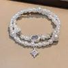 Pulsera de perlas nicho alto sentido temperamento dulce chica personalidad pulsera mayoreo 2024 nueva joyería red