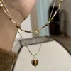 Collar Colgante Gota de Agua Piedra Ojo de Tigre Maillard Estilo Hong Kong Moda Versátil Cadena para Suéter Joyería de Nicho Venta al por Mayor