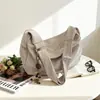 Bolsa tote de grande capacidade, bolsa versátil e estilosa em formato de dumpling para mulheres, nova coleção outono 2026, bolsa transversal de ombro único casual e descontraída