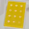 Atacado de cola para cílios de enxerto Tabela de cores Cola em formato de coração 12 furos Junta de vidro Paleta de cílios para unhas