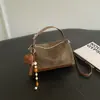 Bolso de mano retro de moda transfronterizo, bolso tipo almohada para mujer, nuevo bolso de hombro de estilo coreano de nicho para el día a día, bolso cruzado simple