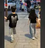 26 Moda Tendencia Tiktok Estilo Coreano Marca Trendy Pedrería Manga Corta Versátil Holgada Manga Corta Camiseta Padre-Hijo para Niños y Niñas