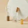 Botellas de perfume de vidrio con forma de pasta de dientes al por mayor, botellas con atomizador de 25 ml para hidratación, botellas de muestra de cosméticos tamaño de viaje