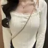 Una generación de cabello otoño e invierno de terciopelo cálido por dentro con temperamento delgado cuello colgante manga larga camiseta mujer top corto irregular