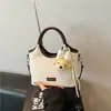 Bolsos de Moda Populares Bolso de Mano para Mujer 2026 Bloque de Color Nuevo Estilo Bolso de Hombro Bolso Cubo Textura Simple Temperamento Bolso Pequeño