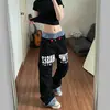 Jeans retro americanos de nicho con doble cintura y paneles empalmados de corte curvo para hombres y mujeres, diseño apilado, que realza la altura, pantalones rectos holgados