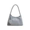 Bolsa Baguete Tecida com Textura Francesa da Moda para Mulheres 2026 Verão Novo Estilo Bolsa Tote Elegante para o Trabalho Bolsa de Ombro Único Sob o Braço