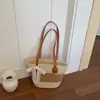 Bolsa de Praia Fashion Estilo Férias Artísticas Ombro Único 2026 Nova Bolsa de Ombro Color Block de Palha Trançada Casual Estilo Balde