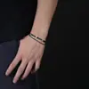 Pulseira de cristal azul-marinho em forma de cruz, de dupla camada, um acessório moderno e versátil para homens e mulheres, adequada para o uso diário e para adicionar um toque de luxo discreto.