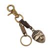 Llavero de piel de vaca vintage para hombre, directo de fábrica punk, con máscara de aleación, colgante decorativo, zona turística, gran oferta
