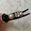 Pinza para el pelo simple de cabeza trasera Flor de perla Pinza de agarre Pinza para el pelo con cabeza de bola Pinza para el pelo de flor de bráctea femenina con temperamento