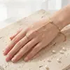 Artículo Popular Transfronterizo: Pulsera de Acero de Titanio Estilo Ins con Flores y Diamantes, Chapada en Oro de 18 Quilates, Nueva Cadena de Muñeca Personalizada de Una Pieza