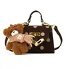 Bolso de lunares estilo coreano para niñas pequeñas, con un adorable charm de oso de peluche, un nuevo minibolso cruzado para bebés y niños