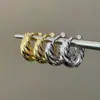 Brincos de metal espiral torcido de moda europeia e americana para mulheres, brincos únicos e de luxo leve de alta qualidade