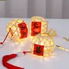 Linterna luminosa de personaje feliz estilo antiguo tejida a mano de bambú linterna de flores de mano linterna pequeña paquete de material DIY colgante venta al por mayor