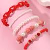 Pulsera infantil de acrílico rosa con cuentas redondas hechas a mano con perlas de arroz de imitación de estilo dulce y nueva artesanía transfronteriza