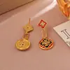 Pendientes de trébol de cuatro hojas del mismo estilo de la serie Wanxiang de la joyería de oro, pendientes y conjunto de collar de moda nicho de tendencia china exquisitos al por mayor