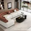Sofá de couro italiano minimalista com cantos arredondados e painéis de cores contrastantes, adequado para salas de estar grandes, sofá modular de couro de formato irregular de luxo leve