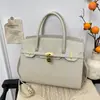 Bolso de Mano Versátil de Moda para Mujer 2026 Nuevo Modelo Bolso Platino de Gama Alta de Nicho Bolso Popular de Lujo para el Trabajo Hombro Cruzado