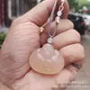 Venta al por mayor de fábrica Colgante de Buda abrazando color rosa jade Colgante de Buda Maitreya ojo de gato azul y blanco Colgante de Buda de jade Colgante de jade Buda de jade