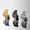 Pendientes de acero de titanio y acero inoxidable con diseño de calavera, garra, hueso de oído, serie de personalidad exagerada, fundición de acero inoxidable para hombres y mujeres