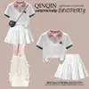 Moda Infantil Grande Oso de Dibujos Animados Dulce Camiseta de Manga Corta con Solapa Conjunto de Dos Piezas Falda Femenina Moda de Verano para Niñas