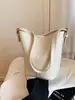 Bolsa de mão versátil para o dia a dia, estilo transfronteiriço, bolsa tipo saco para mulheres, nova coleção de verão 2026, bolsa de ombro/transversal casual e moderna