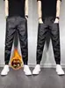 Calças Casuais Masculinas Novas para Outono e Inverno à Prova de Vento Elásticas Calças de Couro para Motociclista Masculinas Calças Leggings Esportivas Quentes de Perna Larga