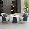 Set sencillo y elegante de sofá individual y mesa de centro, adecuado para áreas de descanso, recepciones de hotel, oficinas de ventas y salas de reuniones