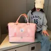 Nueva bolsa de viaje portátil para mujer, venta al por mayor transfronteriza, bolsa de natación y fitness con separación de humedad y secado seco para negocios de corta distancia, bolsa de almacenamiento cruzada.