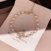 Pulseira de Borboleta com Pérola e Zircônia Banhada a Ouro 18K Real para Mulheres, Alto Padrão, Luxo Leve, Pulseira Elegante, Joia de Mão Exquisita Estilo Francês